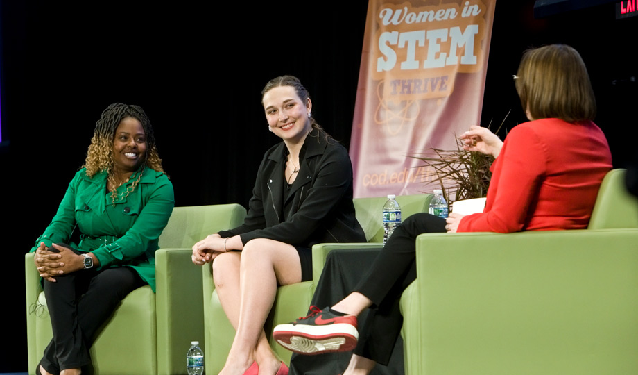 Angel Price, Emma Louden and Ana Belaval sit on stage during a panel discussion