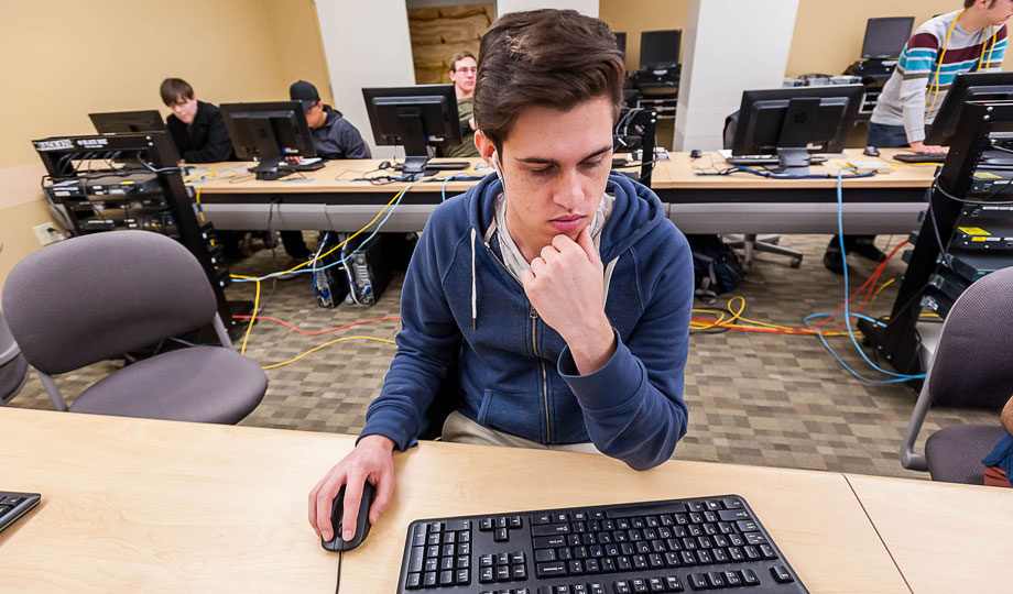 student sits at a computer