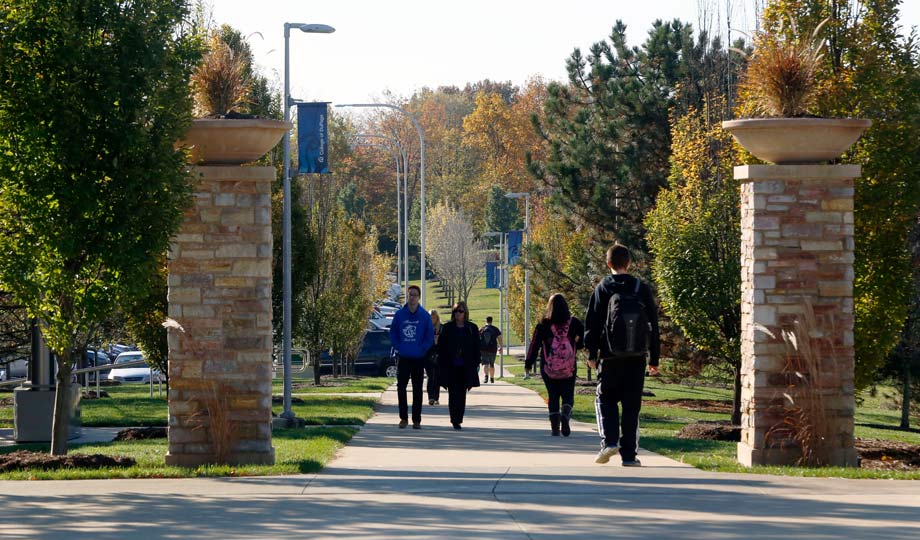 students walking outside on campus