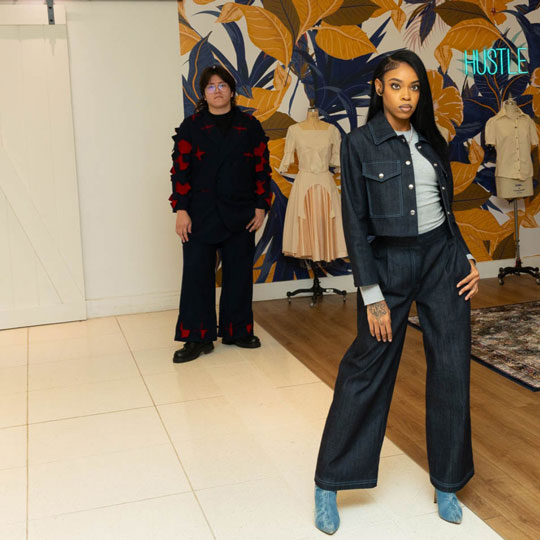 a COD fashion student strikes a pose at the end of a runway