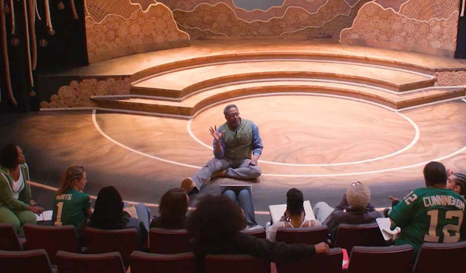 Lindsay Smiling sitting on stage