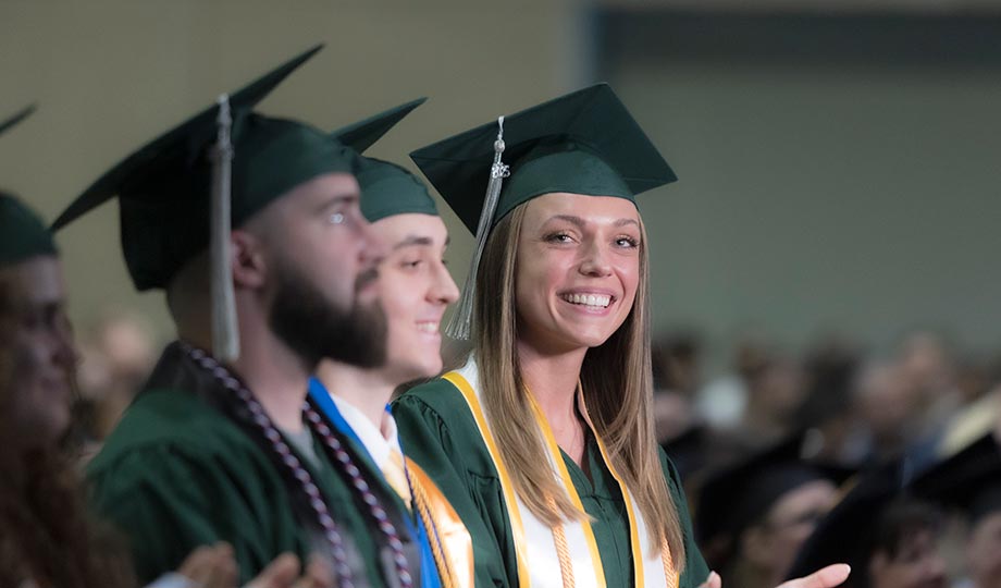 Commencement graduate smiling