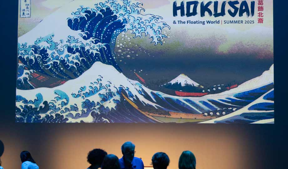 hokusai exhibit with visitors in the foreground