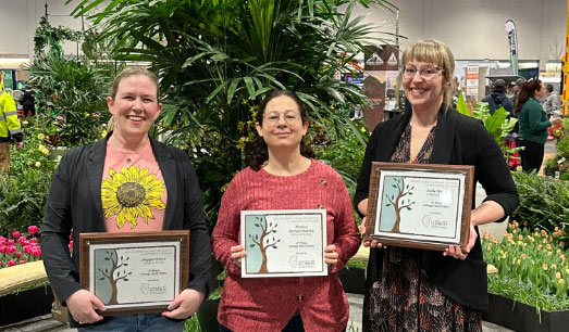 Students Kelly Walker, Maggie Kurcz and Monica Bernal-Munera pose with their awards.