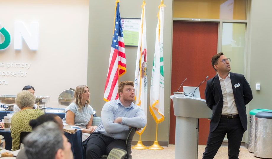 Bradley Lane presenting to legislator event.