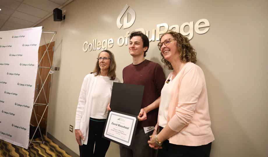 a graduate holds his certificate