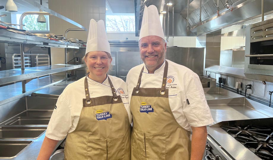Sue and Mike Maddox in chef hats